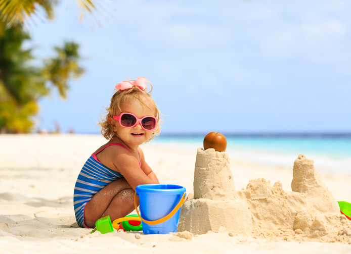 girl playing in sand